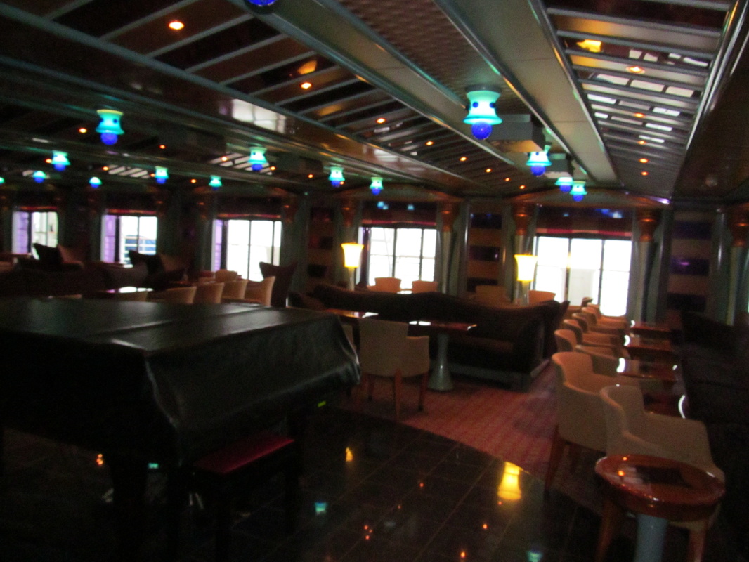 Seating and Piano at Gotham Lounge