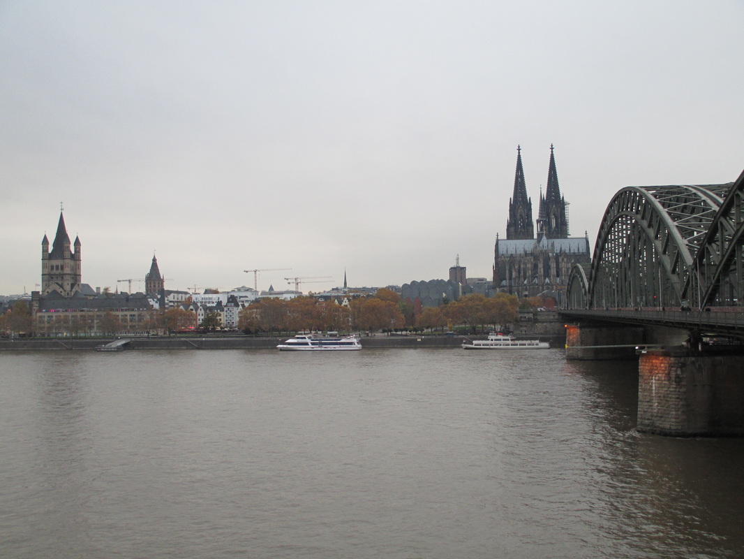 View from opposite bank of river - on left, St. Martin Church and City Hall tower, on right, spires of Cologne Cathedral