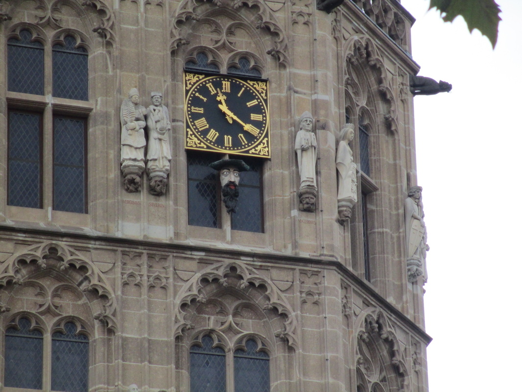 Interesting clock - face of man sticks out his tongue when clock strikes the hour
