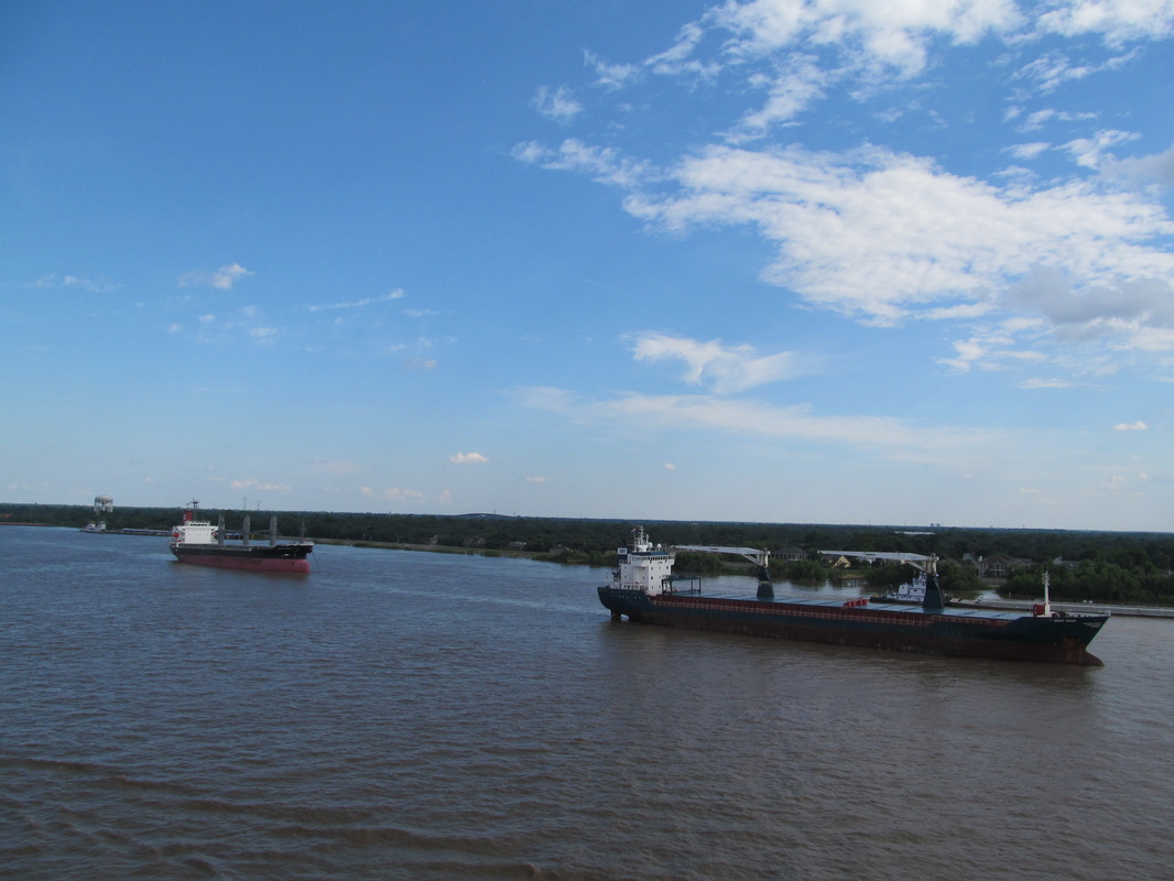 Two Ships Docked Along The Mississippi River