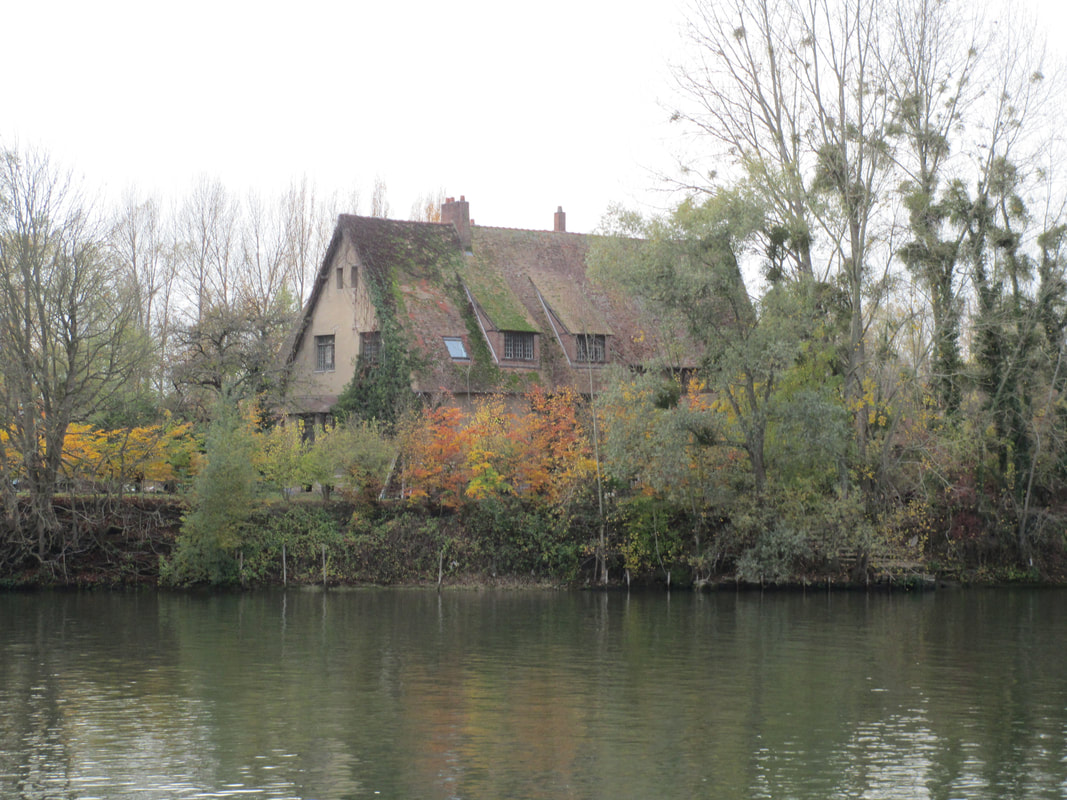View of old house across the Seine River