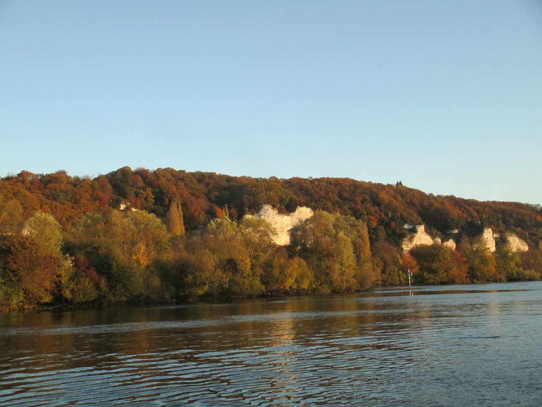 Limestone cliffs and fall colors as cruised on the Seine River